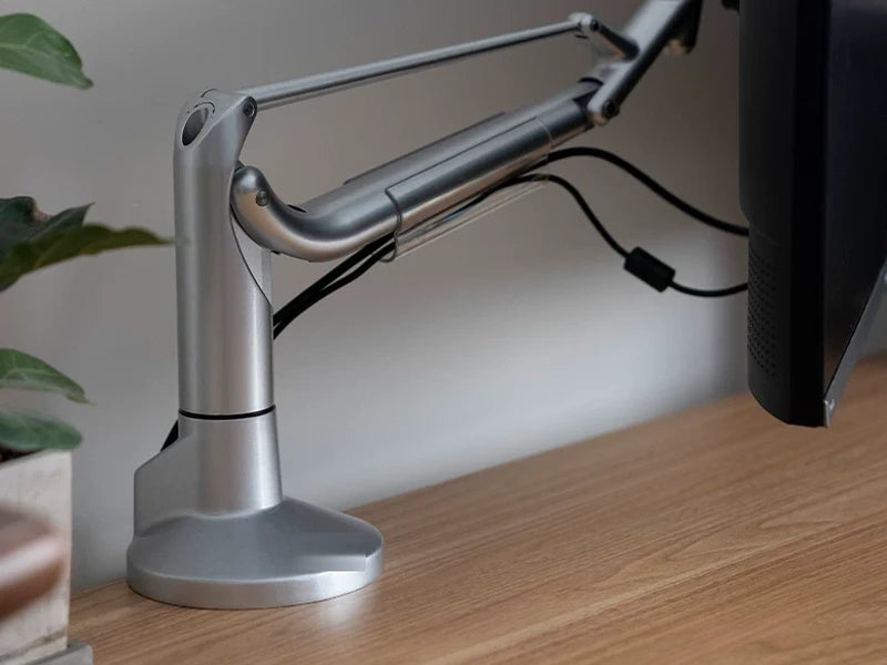 Deskmith single-monitor arm supporting an installed display