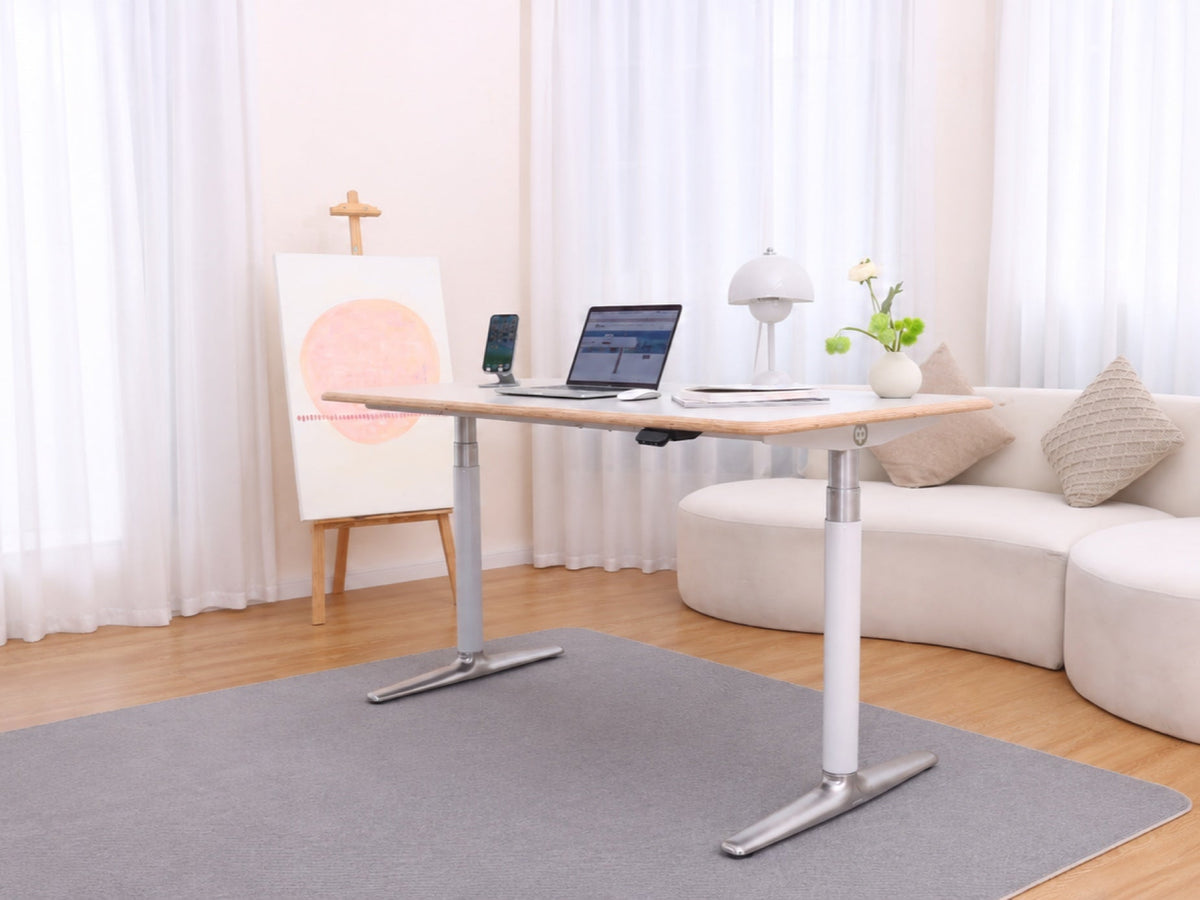 Cashmere Gray Ease Standing Desk in a softly lit home workspace