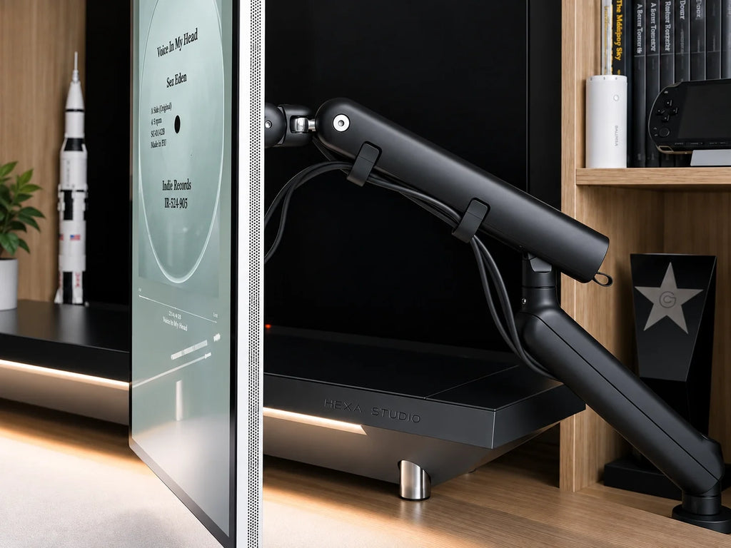 M2 black single-monitor arm side view in a workspace