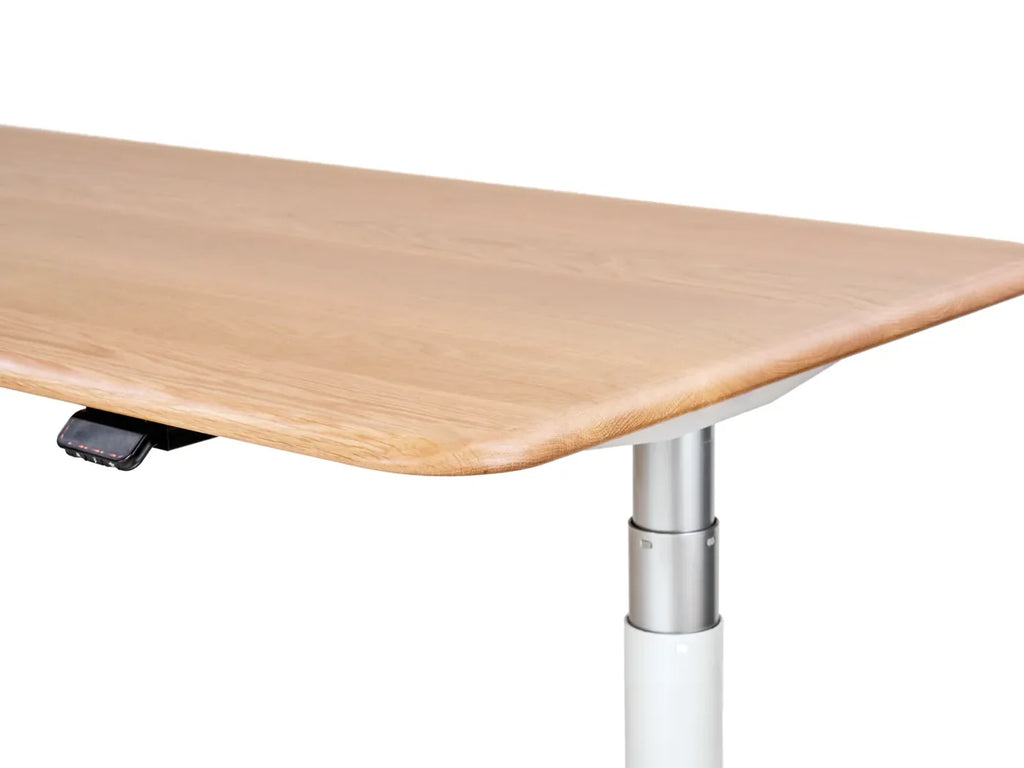 Solid white oak grain, rounded edge and control detail