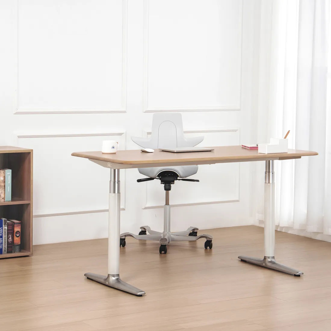Solid white oak standing desk in a bright home workspace