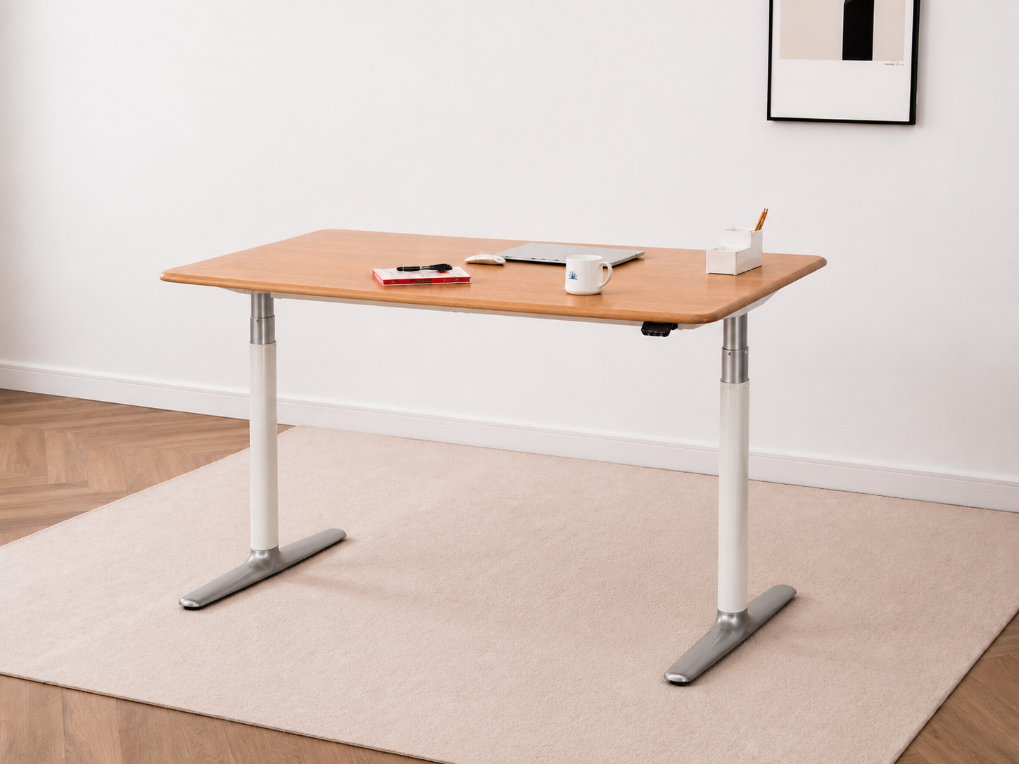 Solid white oak standing desk in a restrained home workspace