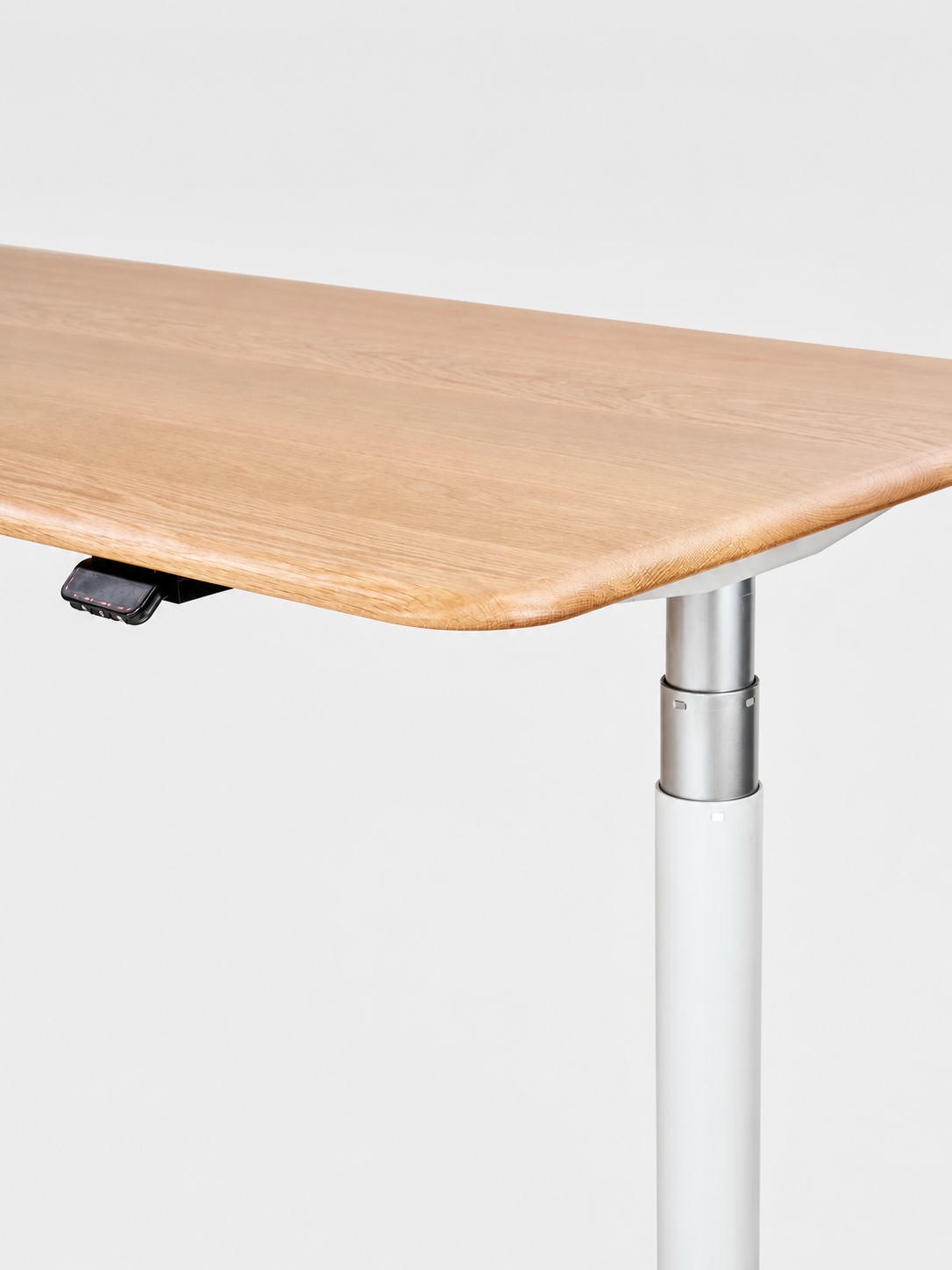 Pale white oak grain and the softened desktop edge