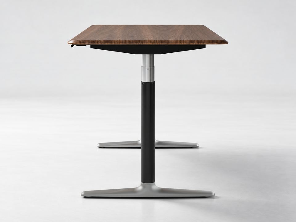 Nature Walnut Standing Desk viewed from the short side, showing the walnut desktop and Black with Silver lifting frame