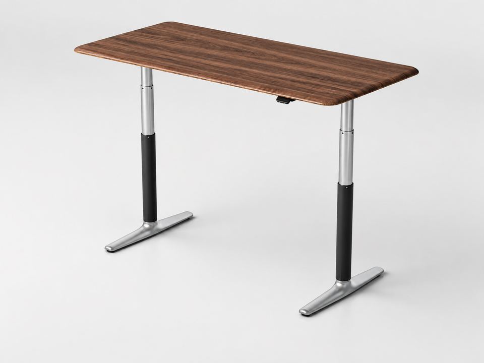 Nature Walnut Standing Desk with Black with Silver frame at standing height, three-quarter studio view