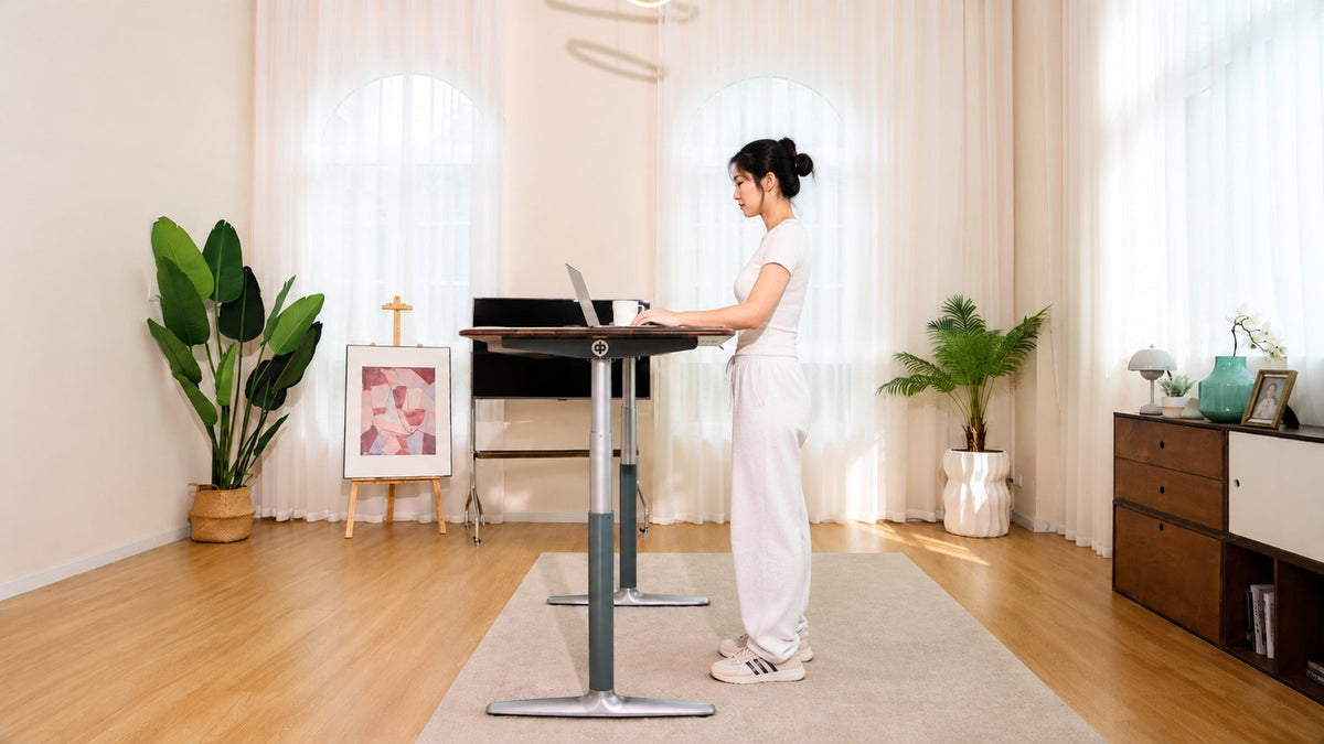 Person working at the solid walnut desk while standing