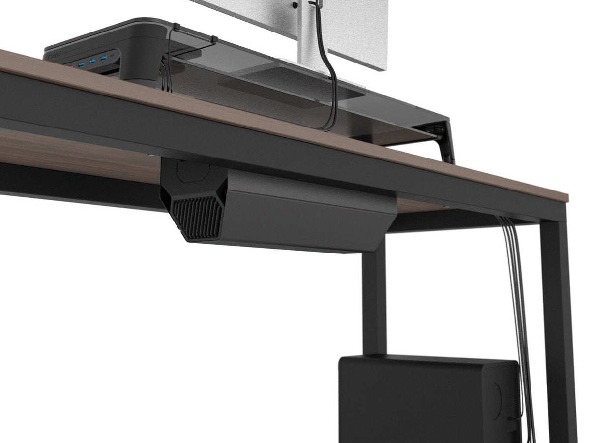Standing desk with the cable management box mounted beneath the desktop and the computer tower on the floor