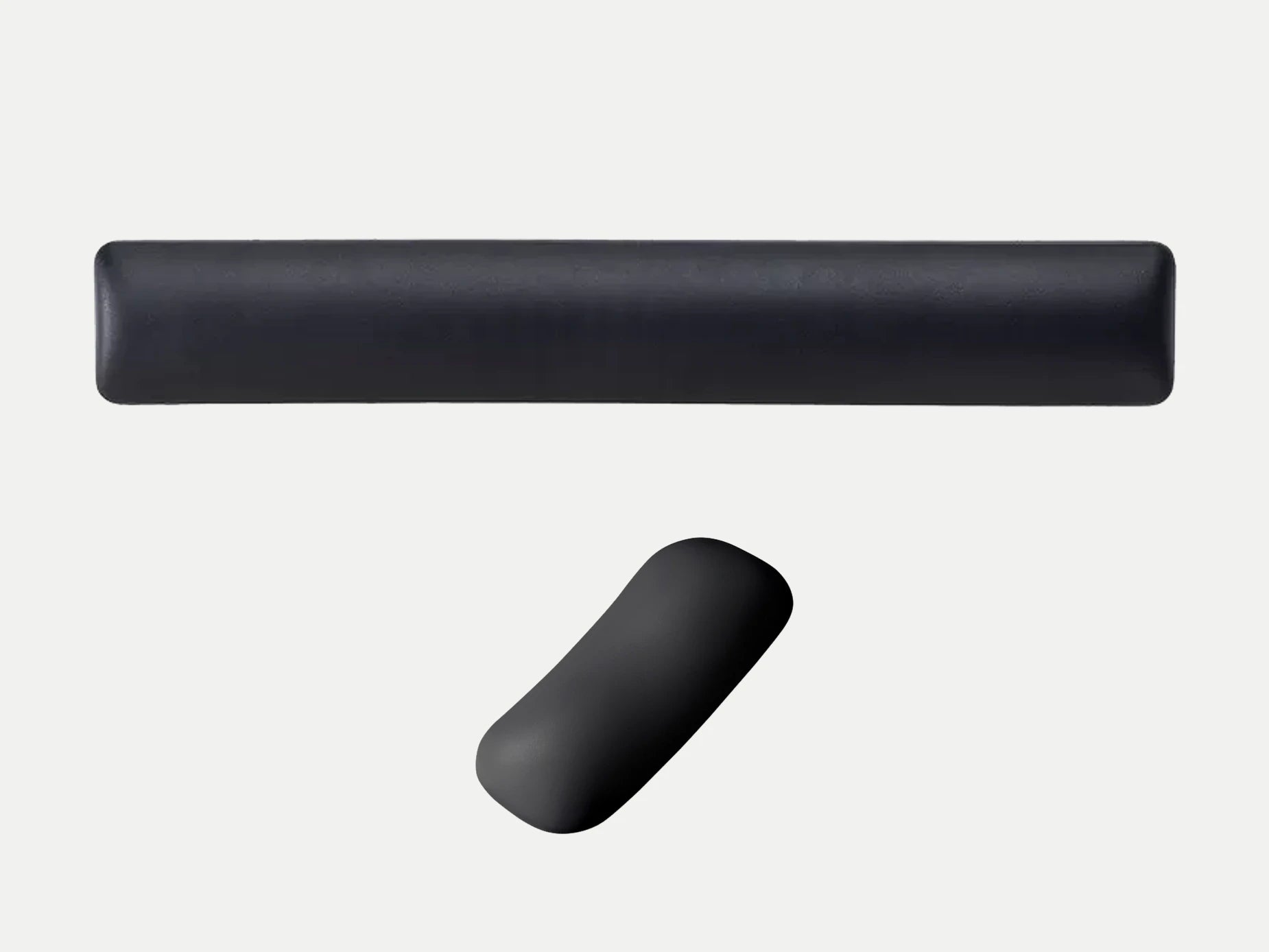 Black mouse and keyboard wrist rests shown at the same physical scale