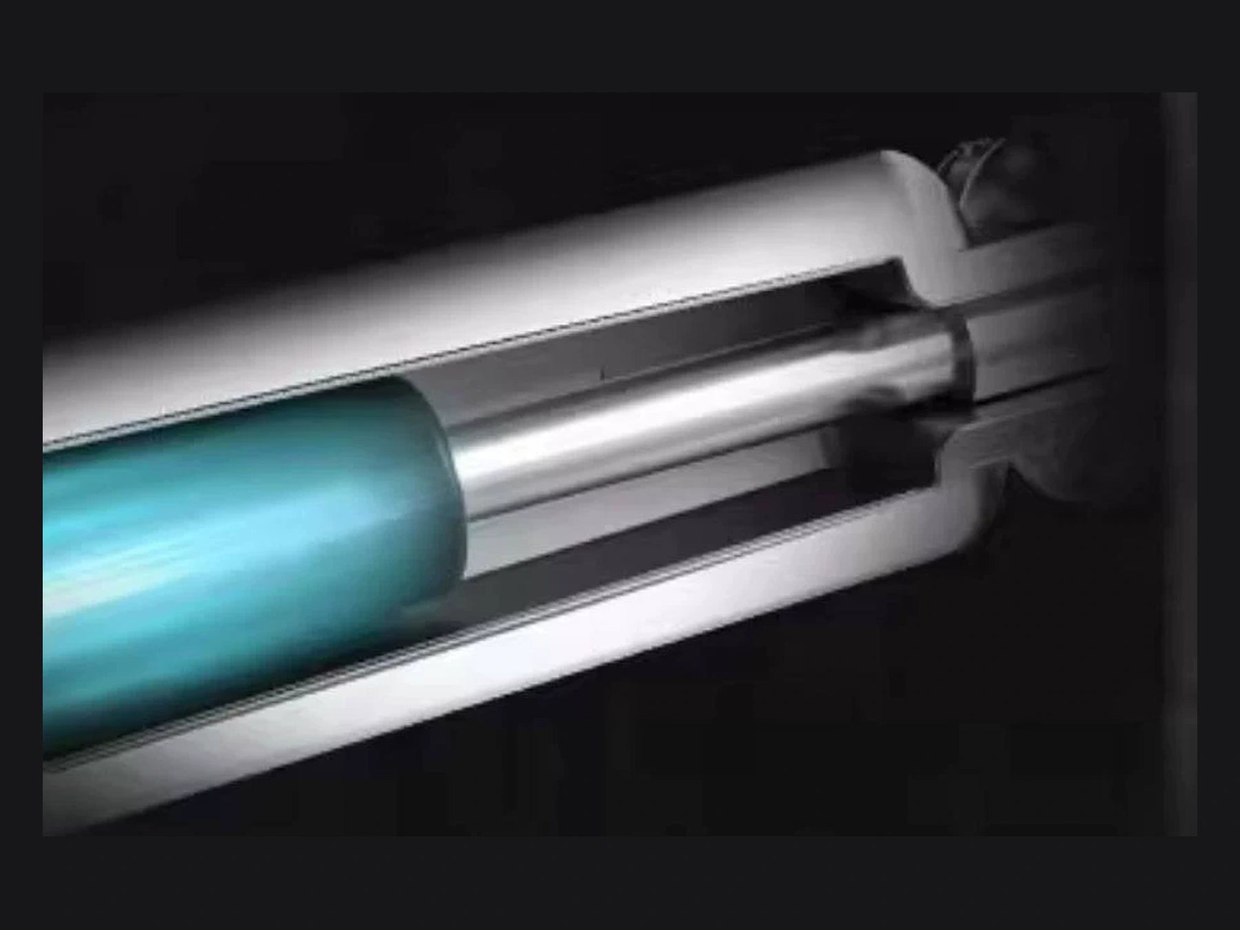 Exposed gas spring inside the silver monitor arm